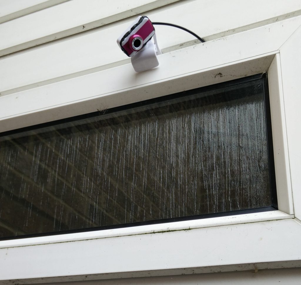 USB webcam mounted outside window
